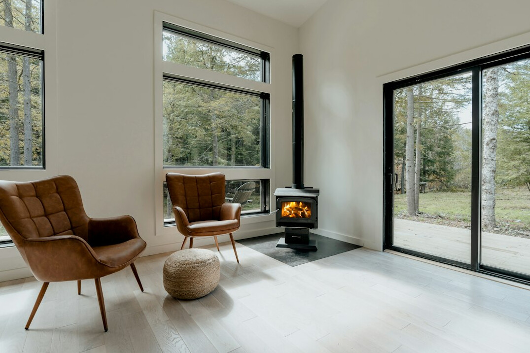 Comfortable modern home interior with large windows