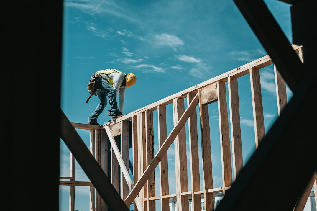 Craftsman installing a part on a building